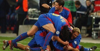 Basel celebrate their third goal against Liverpool