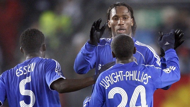 Drogba double fires Chelsea through