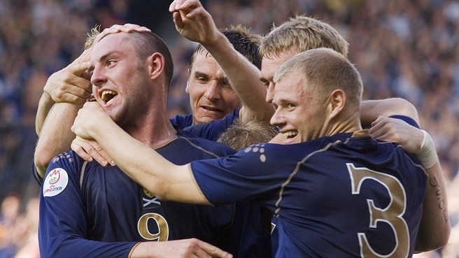 Late goals keep Scotland soaring