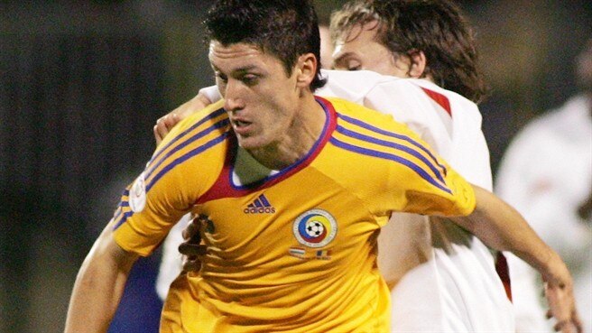 Romania qualify at a canter
