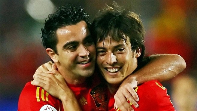 Xavi secures top spot for Spain