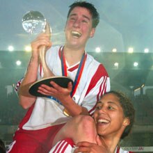 Frankfurt goalscorer Birgit Prinz holds aloft the UEFA Women's Cup